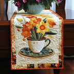 Flower Filled Teacup on Orange Table Runner