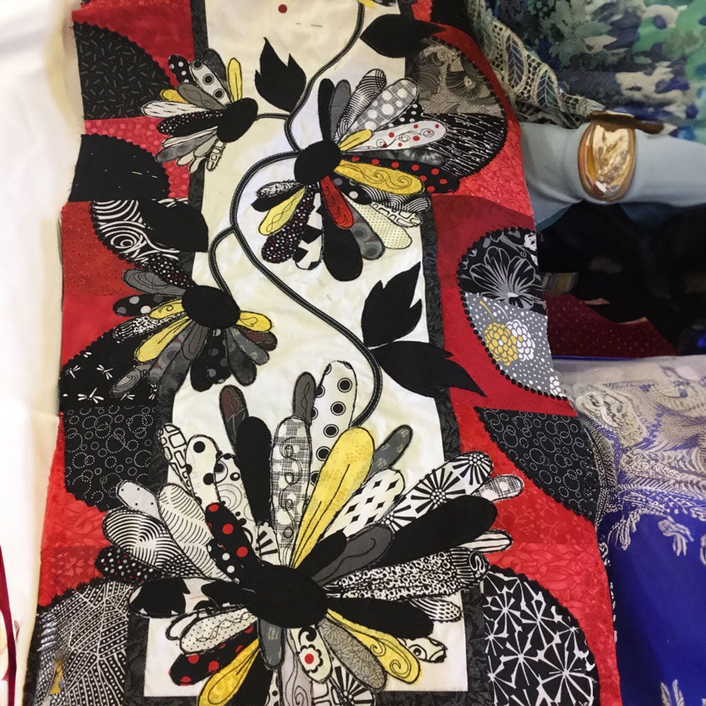 Black and White Blooms with Red Table Runner