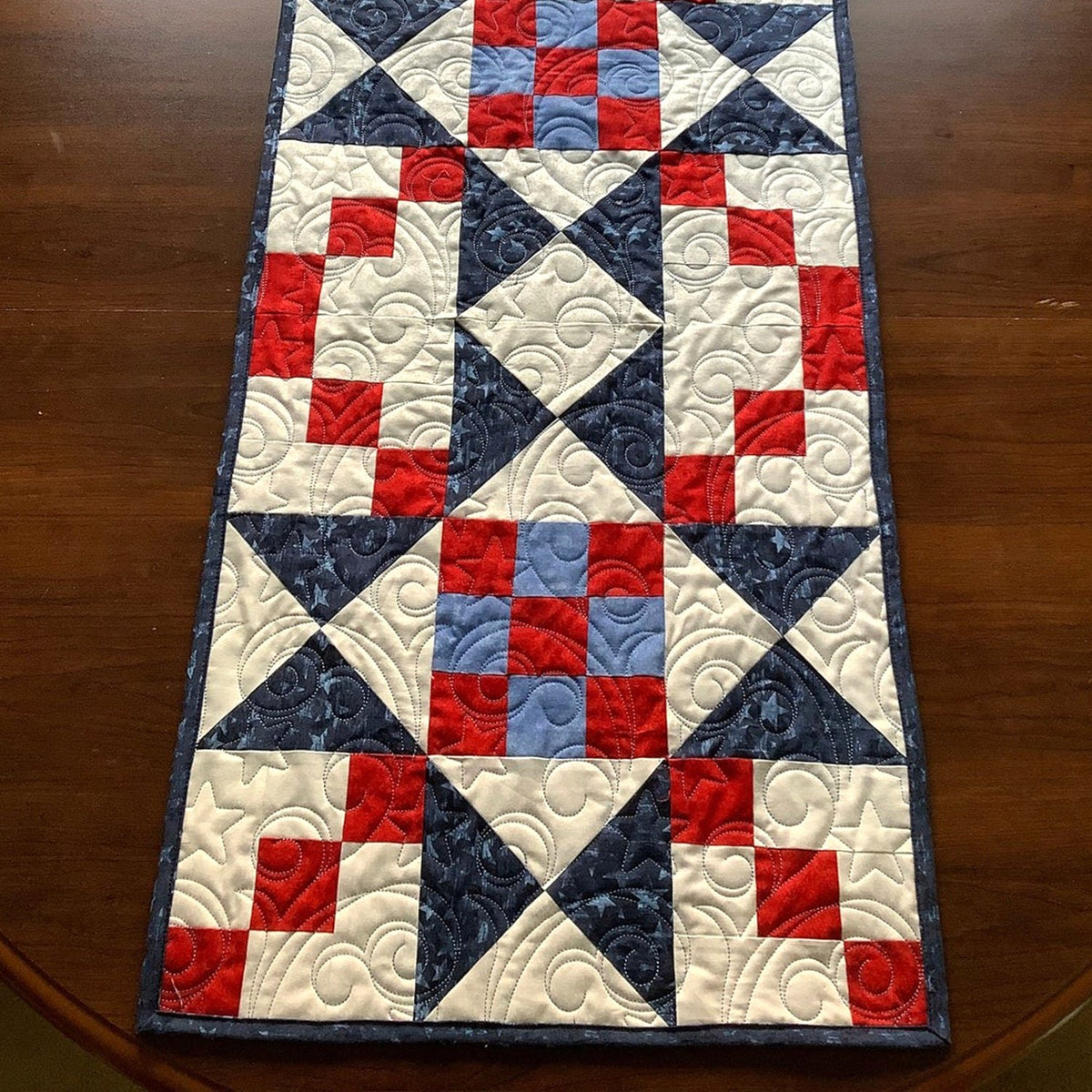 Red and Navy Pinwheel Blocks Table Runner