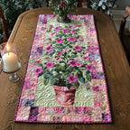 Potted Pink Flowers on Pink Patchwork Table Runner
