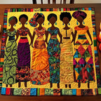 Women in Colorful Dresses on Gold Table Runner