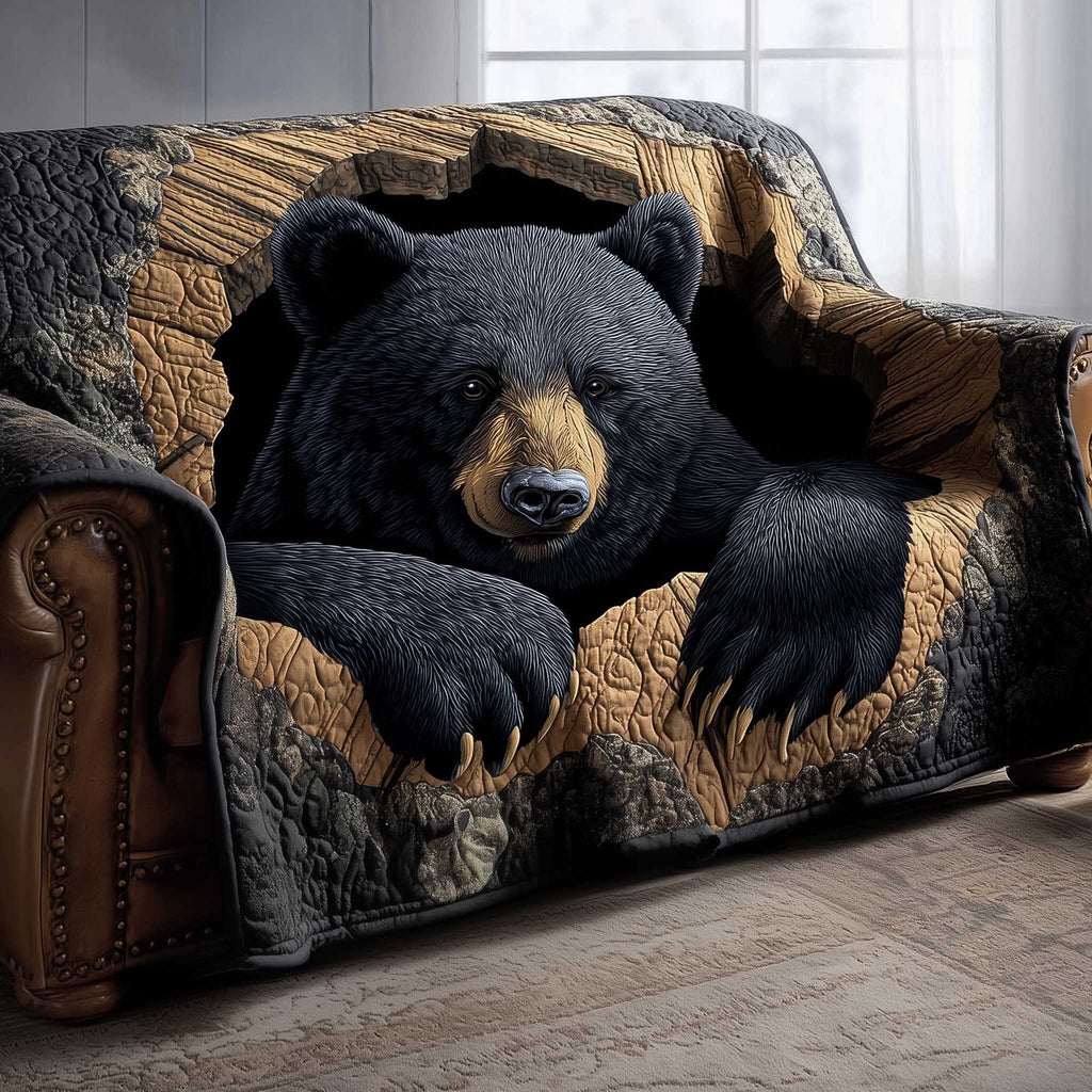 Black Bear Resting on Tan Quilt Sofa Cover