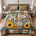 All Hope Is In Jesus quilted 3-piece bedding set on a made bed in a softly lit bedroom