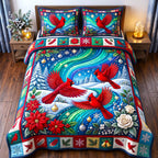 Aurora Red Cardinal quilted 3-piece bedding set on a made bed with two matching pillow shams