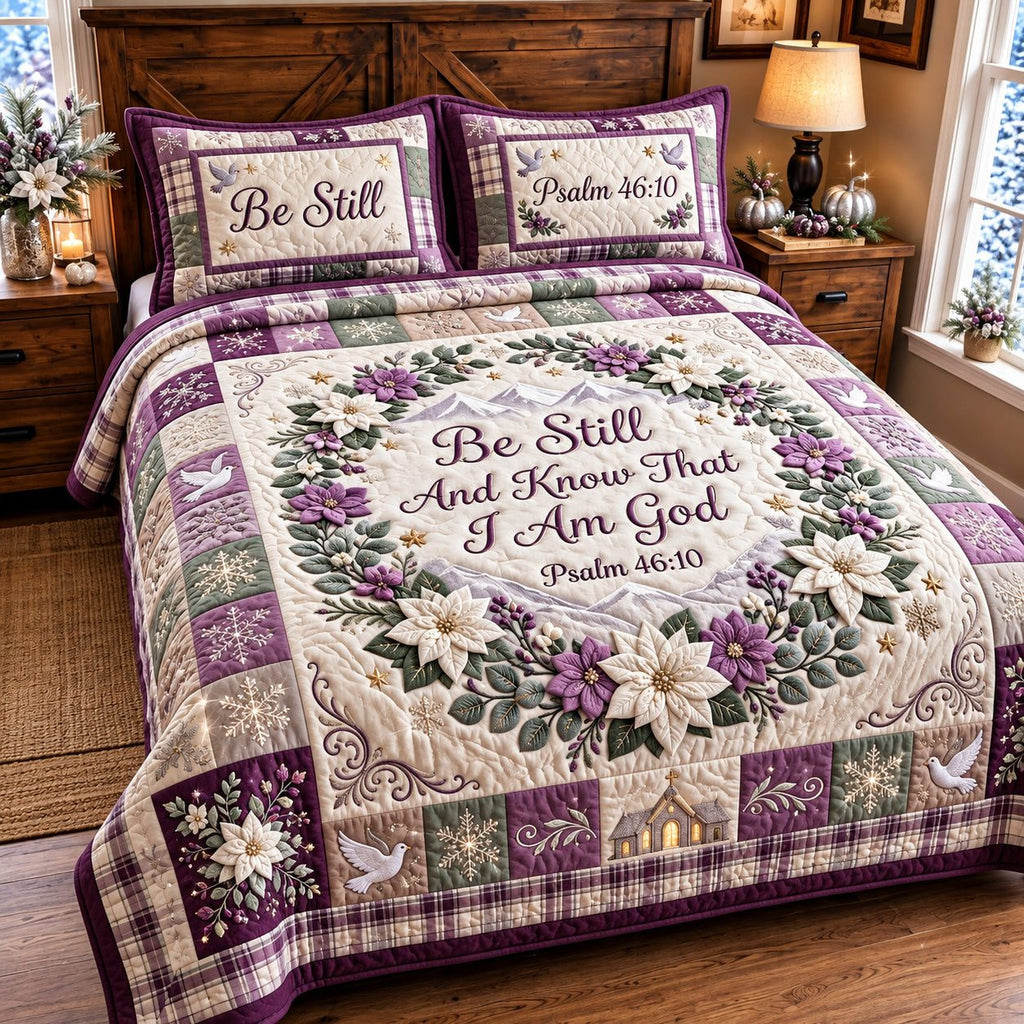 Be Still Faith quilted 3-piece bedding set on a made bed in a softly lit bedroom