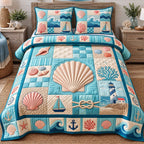 Big Seashell Coastal Patchwork quilted 3-piece bedding set on a made bed in a light coastal bedroom