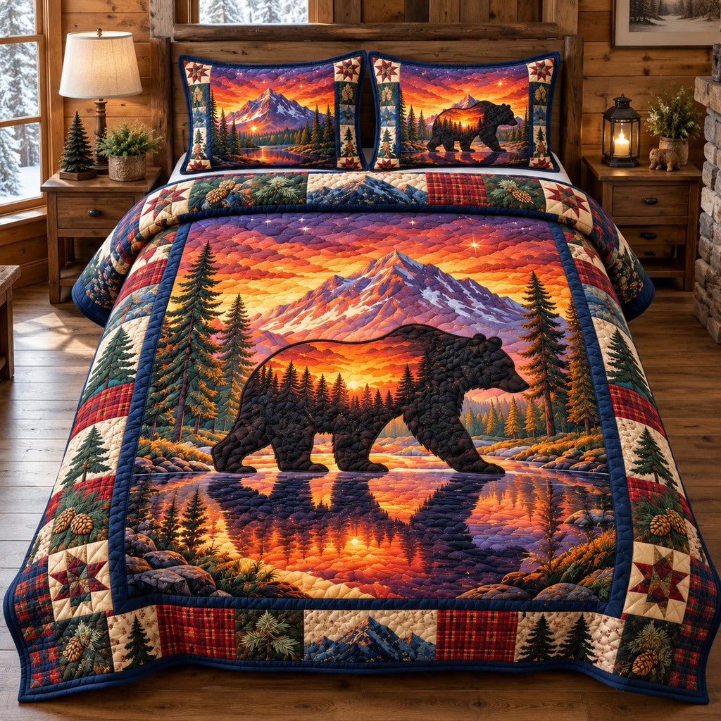 Black Bear Mountain Sunset quilted 3-piece bedding set on a made bed with two matching pillow shams