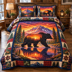 Black Bear Mountain Sunset quilted 3-piece bedding set on a made bed with two matching pillow shams