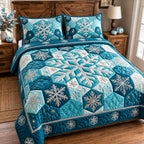 Blue Snowflake quilted 3-piece bedding set on a made bed in a winter-styled bedroom