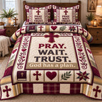 Burgundy Pray Wait Trust quilted 3-piece bedding set on a made bed in a softly lit bedroom