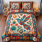 Cactus Garden Sacred Bird quilted 3-piece bedding set on a made bed in a softly lit bedroom