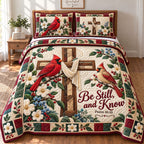 Cardinals Cross quilted 3-piece bedding set on a made bed in a softly lit bedroom