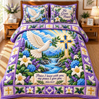 Christian Garden quilted 3-piece bedding set on a made bed in a softly lit bedroom