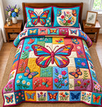 Colorful Butterfly quilted 3-piece bedding set on a made bed with two matching pillow shams