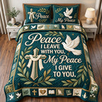 Dove Peace quilted 3-piece bedding set on a made bed with two matching pillow shams