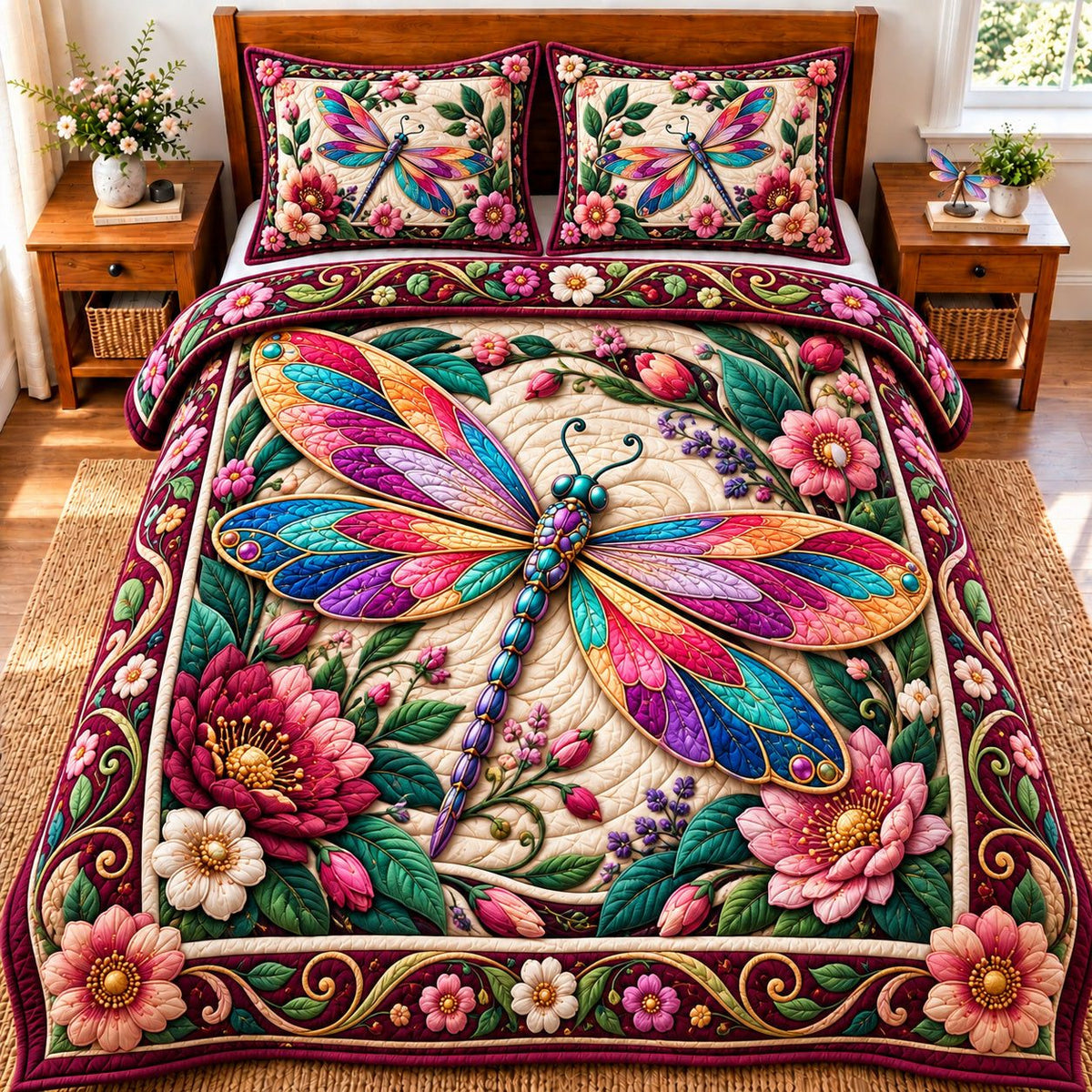 Dragonfly Garden Magic quilted 3-piece bedding set on a made bed with two matching pillow shams