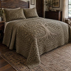 Earthbound Tree Of Life quilted 3-piece bedding set on a made bed with two matching pillow shams