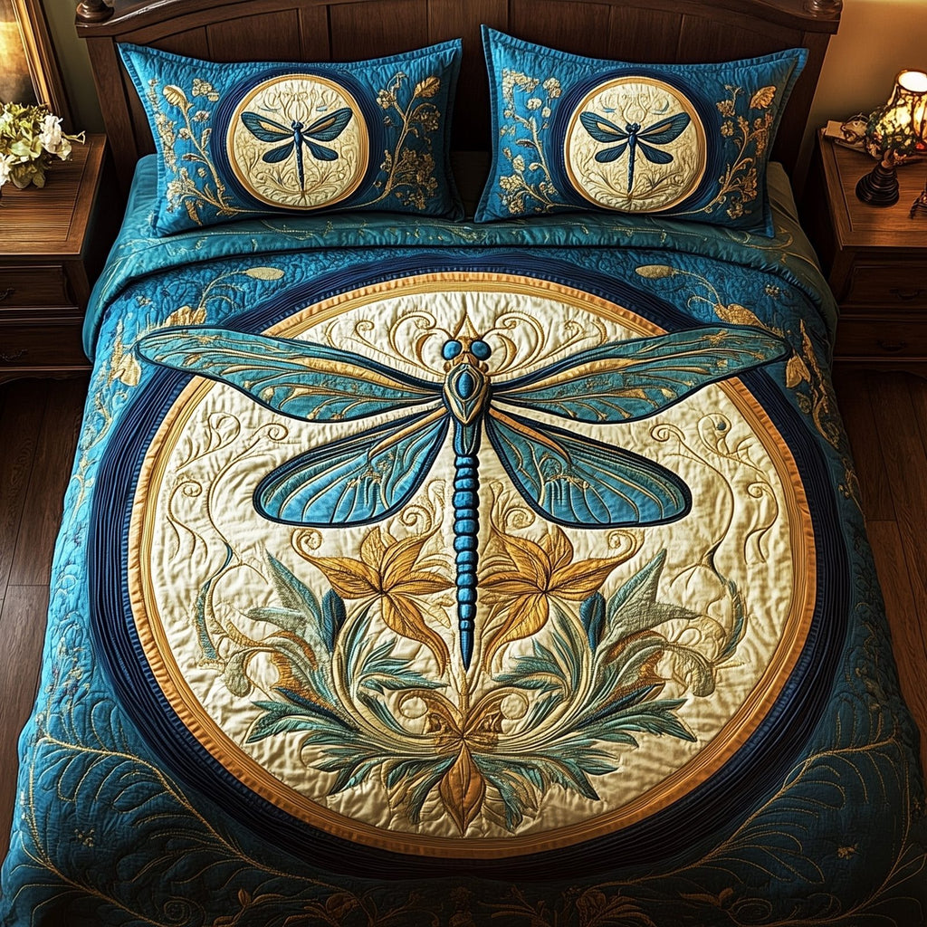 Enchanted Dragonfly Gold Blue quilted 3-piece bedding set on a made bed with two matching pillow shams