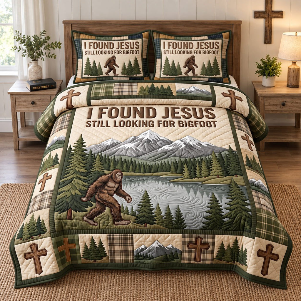 Faithful Bigfoot Woods quilted 3-piece bedding set on a made bed in a softly lit bedroom