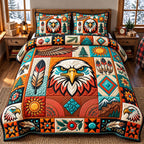 Feather Patchwork Eagle Spirit quilted 3-piece bedding set on a made bed in a warmly lit bedroom