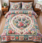 Floral Heart Paw Medallion quilted 3-piece bedding set on a made bed with two matching pillow shams