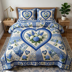Floral Patchwork Blue Heart quilted 3-piece bedding set on a made bed in a farmhouse bedroom