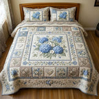 Floral Patchwork Heart Hydrangea quilted 3-piece bedding set on a made bed in a farmhouse bedroom