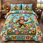 Flower Meadow Bigfoot Forest Legend quilted 3-piece bedding set on a made bed with two matching pillow shams