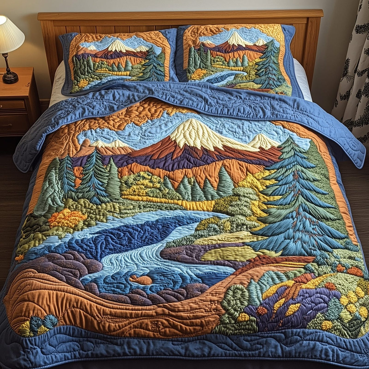Forest Blue River Peaks quilted 3-piece bedding set on a made bed with two matching pillow shams