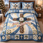 Frosty Joy Cross quilted 3-piece bedding set on a made bed in a winter-styled bedroom
