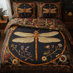 Golden Dragonfly Night Floral quilted 3-piece bedding set on a made bed with two matching pillow shams