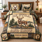 Golden Sunrise Buck quilted 3-piece bedding set on a made bed with two matching pillow shams