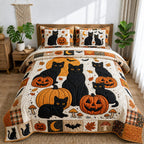 Halloween Black Cats Pumpkins quilted 3-piece bedding set on a made bed against a dark styled interior