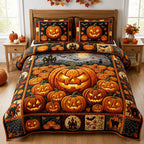 Halloween Pumpkin Pile quilted 3-piece bedding set on a made bed against a dark styled interior