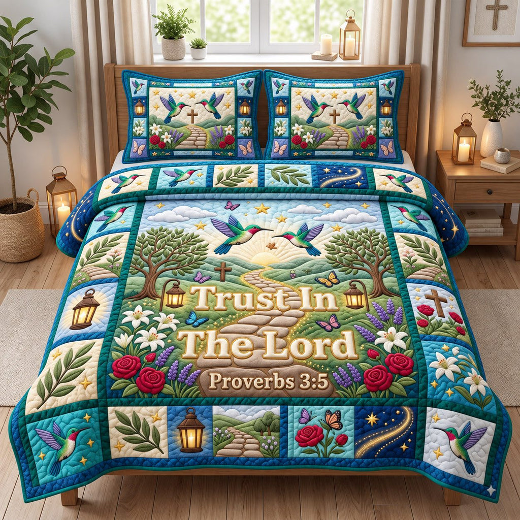 Hummingbird Path Trust In The Lord quilted 3-piece bedding set on a made bed in a softly lit bedroom