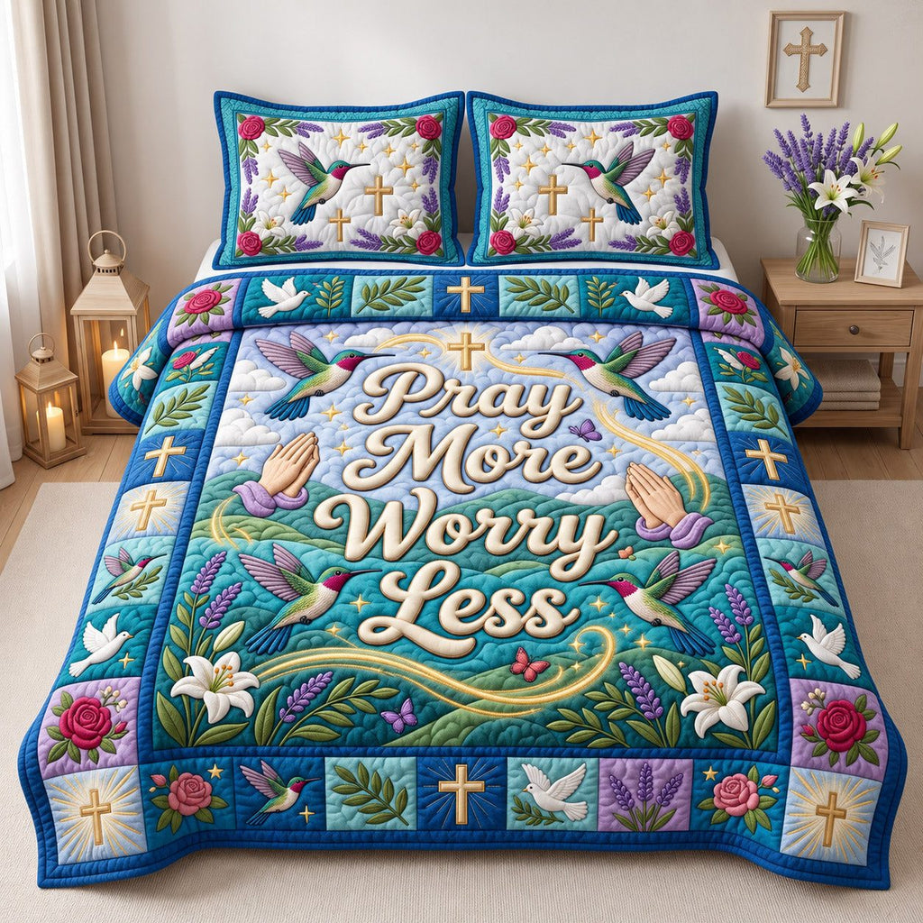 Hummingbird Pray More Worry Less quilted 3-piece bedding set on a made bed in a softly lit bedroom