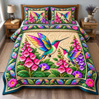 Hummingbird Stained Glass quilted 3-piece bedding set on a made bed with two matching pillow shams