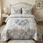 Hydrangea Patch Garden quilted 3-piece bedding set on a made bed with two matching pillow shams
