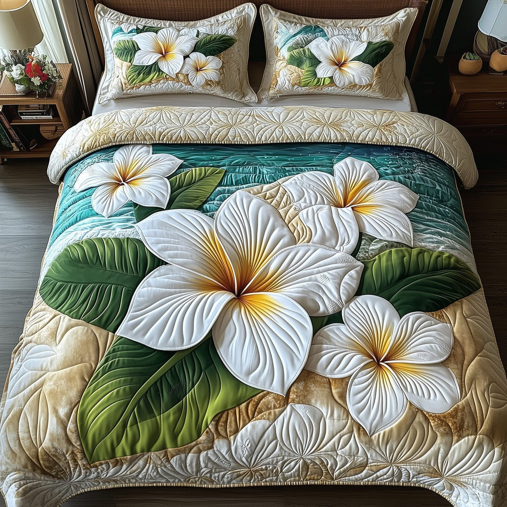 Island Plumeria Cream quilted 3-piece bedding set on a made bed in a light coastal bedroom