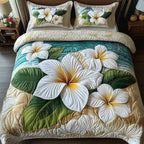 Island Plumeria Cream quilted 3-piece bedding set on a made bed in a light coastal bedroom