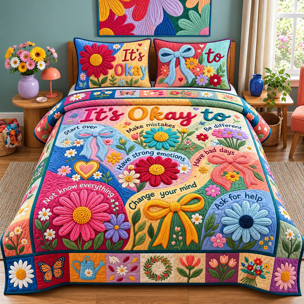 Its Okay quilted 3-piece bedding set on a made bed with two matching pillow shams
