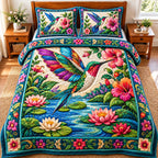 Jeweled Hummingbird Water Garden quilted 3-piece bedding set on a made bed with two matching pillow shams