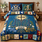 JMJ Holy Family Monogram quilted 3-piece bedding set on a made bed in a softly lit bedroom