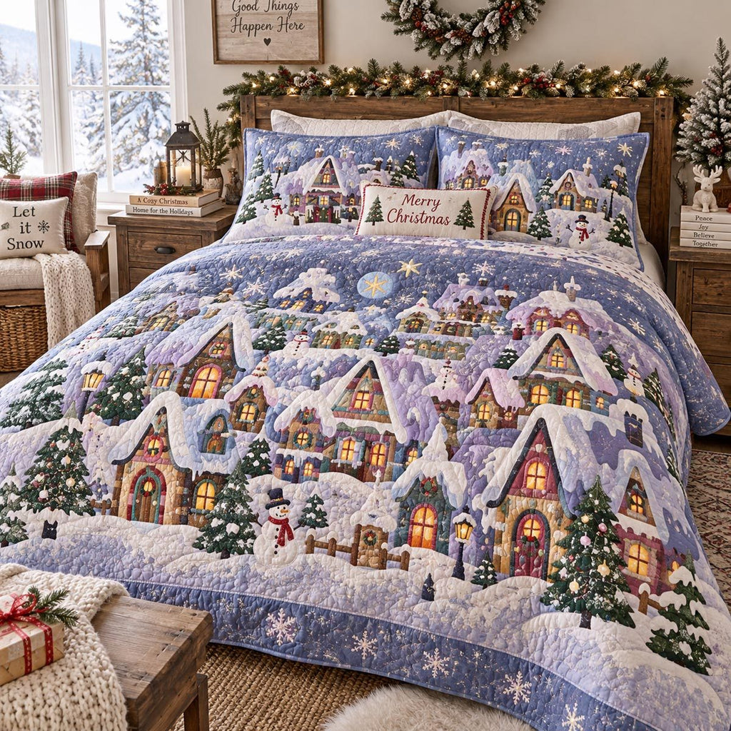 Lavender Snowy Village quilted 3-piece bedding set on a made bed with two matching pillow shams