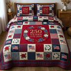 Liberty Legacy Wreath Red quilted 3-piece bedding set on a made bed in a warmly lit bedroom
