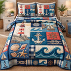 Lighthouse Anchor Coastal Patchwork quilted 3-piece bedding set on a made bed in a light coastal bedroom