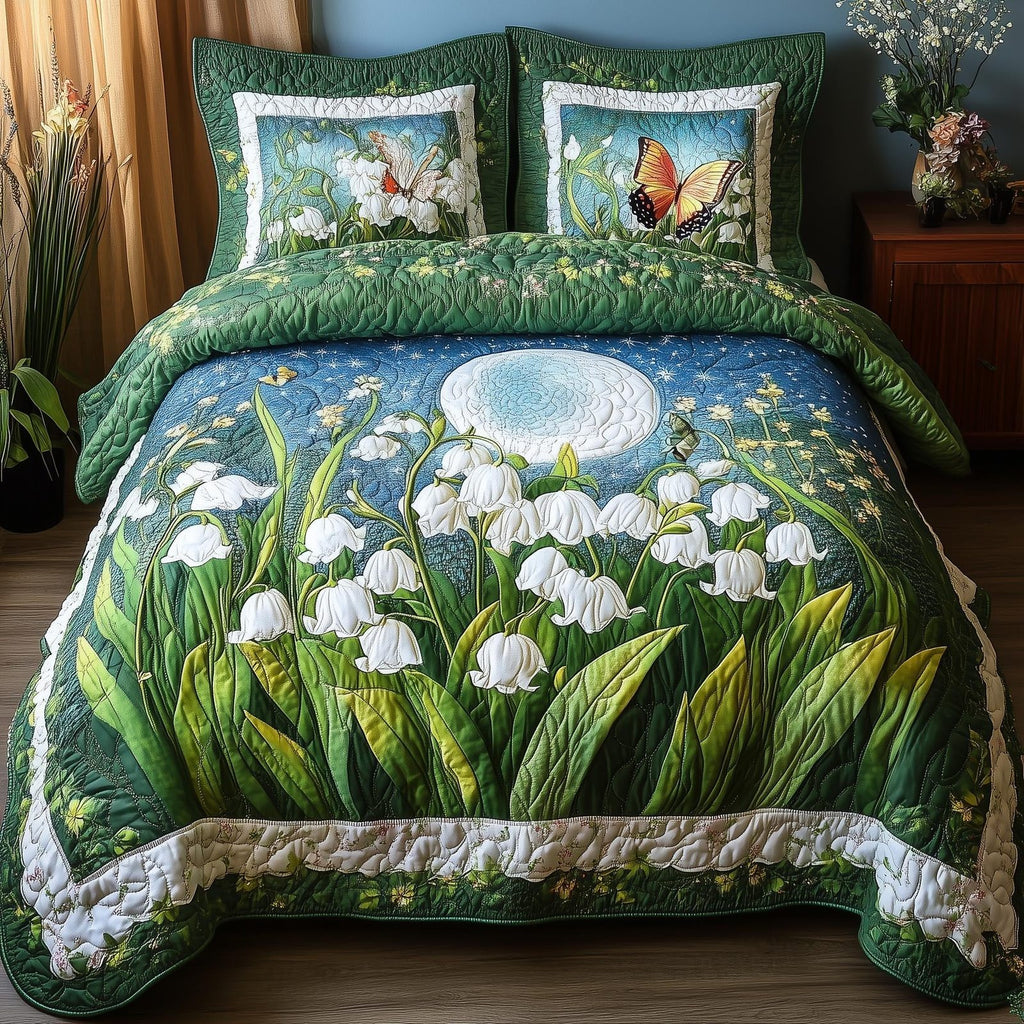 Lily Butterfly Night quilted 3-piece bedding set on a made bed with two matching pillow shams