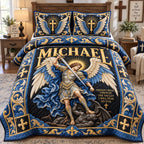 Michael Guardian Of Faith quilted 3-piece bedding set on a made bed in a softly lit bedroom