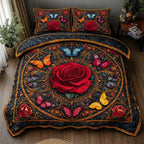 Midnight Rose Butterflies quilted 3-piece bedding set on a made bed with two matching pillow shams