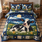 Moonlight Meadow Cow quilted 3-piece bedding set on a made bed with two matching pillow shams
